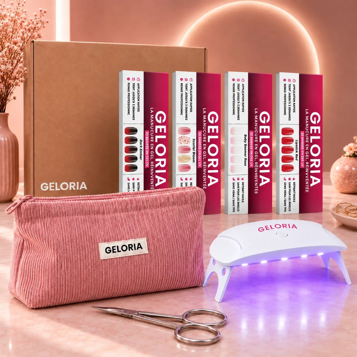 Pack Premium Geloria : quatre étuis de bandes de gel, la lampe LED UV, la trousse et les ciseaux à cuticules